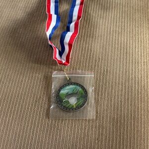 Golf Medal with Red, White, and Blue Ribbon